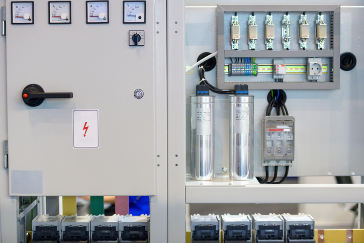 Automated Power Factor Correction equipment installed in a commercial electrical panel to stabilize voltage and improve system capacity.